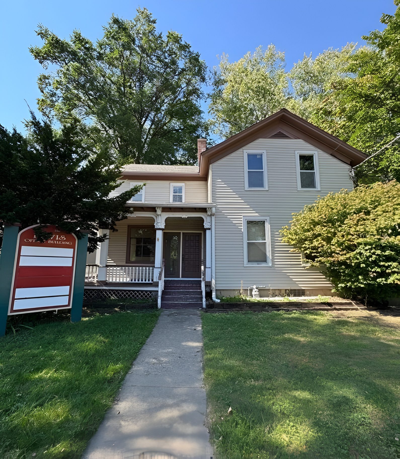 Two-story house with a front porch.
