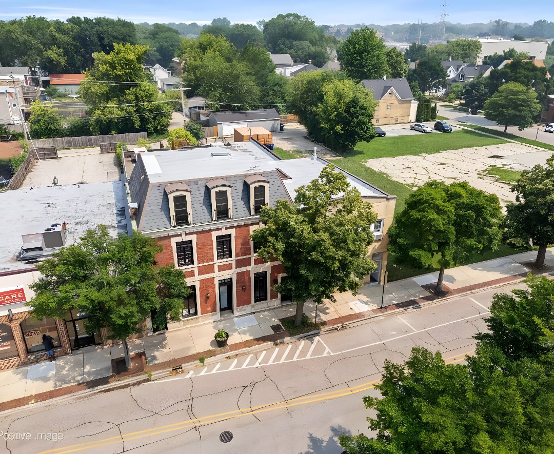 Street view with trees and buildings.